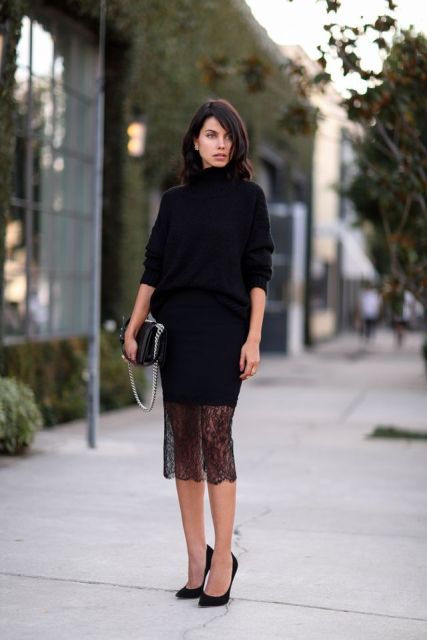 With black turtleneck sweater, black bag and black high heels