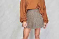 With brown loose blouse and black sock boots