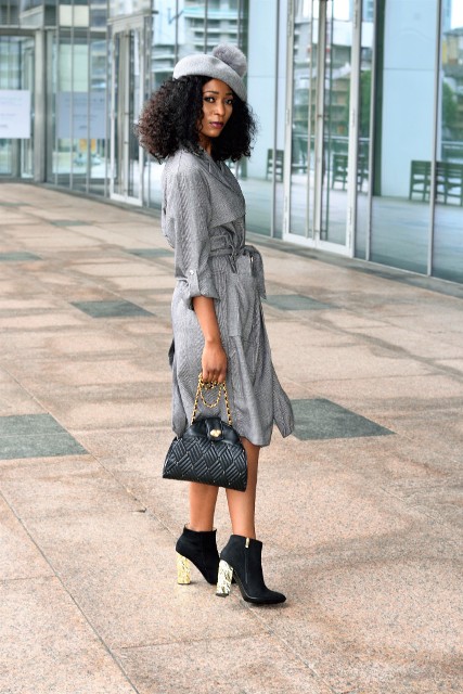 With gray coat, chain strap bag and metallic and black heeled boots