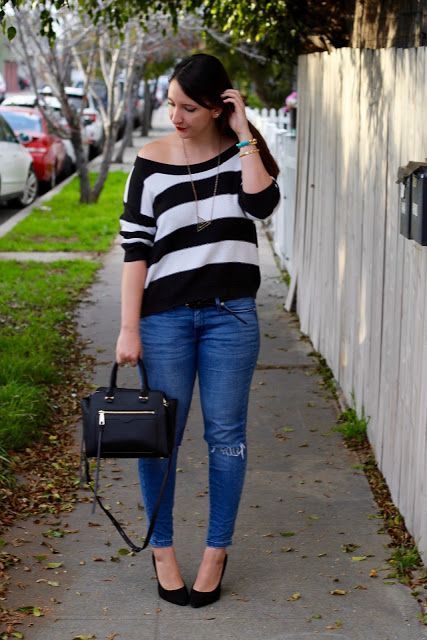 With jeans, black bag and black high heels