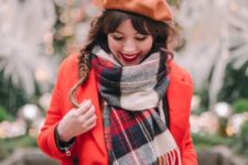 With orange dress, red coat and plaid oversized scarf