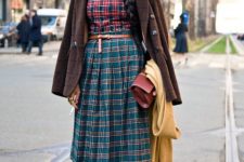 With plaid shirt, hat, brown jacket, clutch, yellow tights and heeled shoes