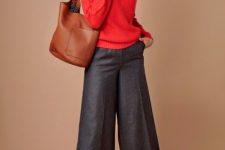 With red sweater, brown leather tote bag and black and brown heels