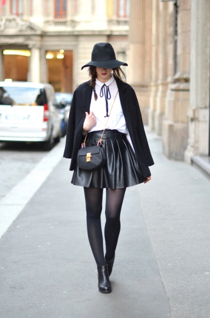 With white shirt, black blazer, wide brim hat, chain strap bag and black ankle boots