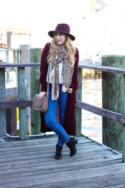 With white shirt, marsala long cardigan, beige bag, leopard scarf, skinny jeans and black ankle boots