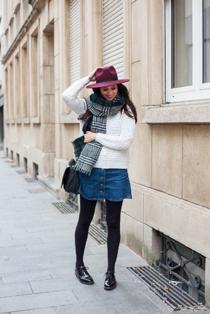 With white sweater, denim skirt, plaid scarf, black lace up shoes and bag