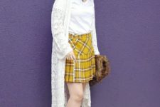 With white t-shirt, white knitted long cardigan, hat, fur bag and white shoes