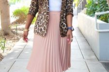 With white top and pale pink pleated midi skirt