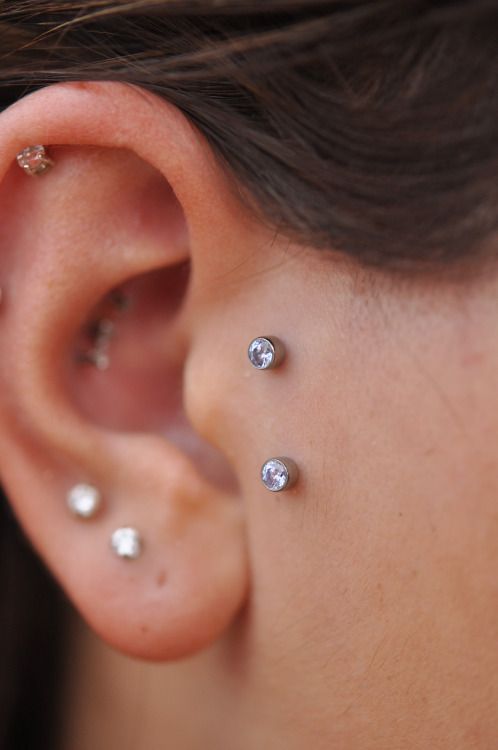 a double microdermal piercing and multiple ear piercings will highlight your ears a lot