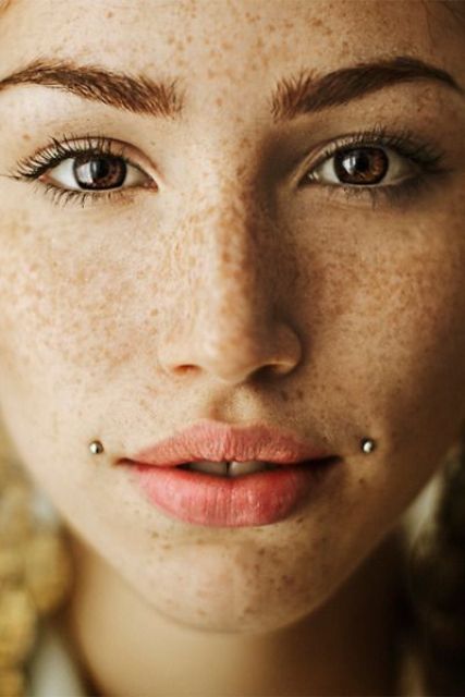 a double microdermal piercing on the face is a very daring and bold idea