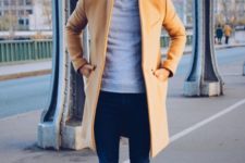 a grey tee, navy jeans, a camel coat and black shoes – you don’t need more to look good