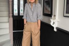 a striped black and white shirt, beige oversized pants, red shoes for a vintage-inspired and chic look