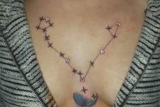 highlighting a cool constellation tattoo with severla dermal piercings is a bold solution