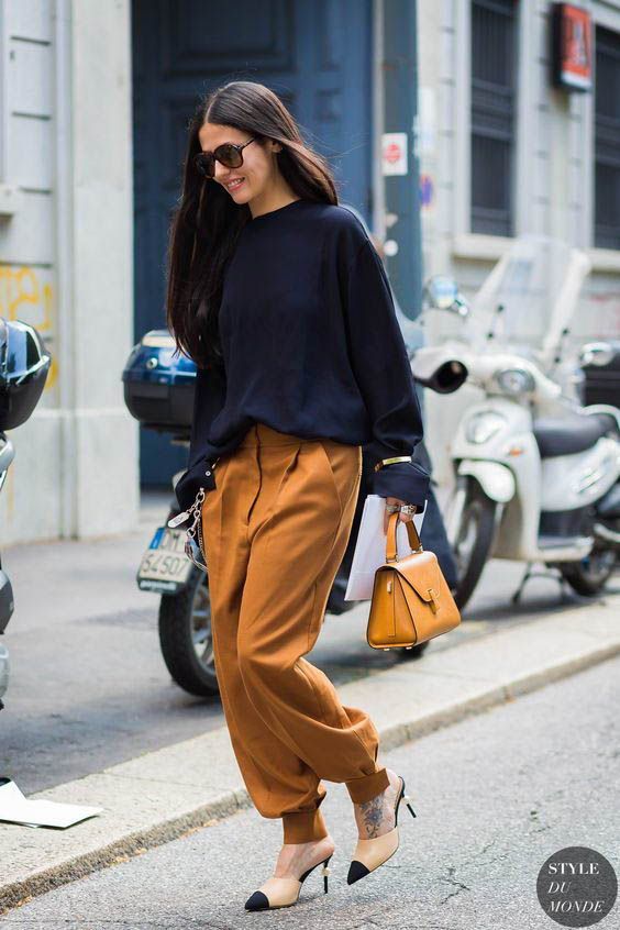 oversized camel pants, a navy jumpser, two tone shoes and a bold small bag for a bit of edge