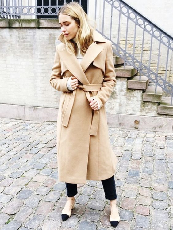 a chic camel wrap coat of a midi length and two toned shoes for an ultimately elegant look in winter