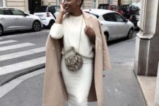 08 a chic winter look with a white sweater, a white midi pencil skirt, white trainers, a camel coat and a snake leather bag