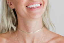 10 a delicate chain choker necklace paired with a more delicate one with a pendant for a relaxed and boho look