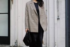 12 a black slip midi dress, an oversized plaid blazer, black shoes and a black bag for an edgy touch