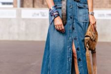 13 a chic look with a teal sweater, a blue denim maxi skirt, a brown belt, a bag and strappy shoes