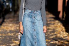 15 a simple fall outfit with a grey turtleneck, a blue denim maxi skirt on buttons, white sneakers and a white bag
