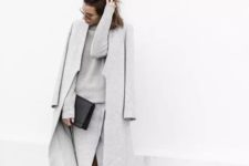 16 an elegant knit grey suit with a long sleeve top and a midi wrap skirt, a grey coat and white sneakers
