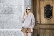 With beige oversized sweater, suede cutout boots and bag