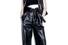 With black crop top, black leather vest and flat shoes