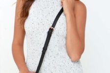 With black crossbody bag and sunglasses