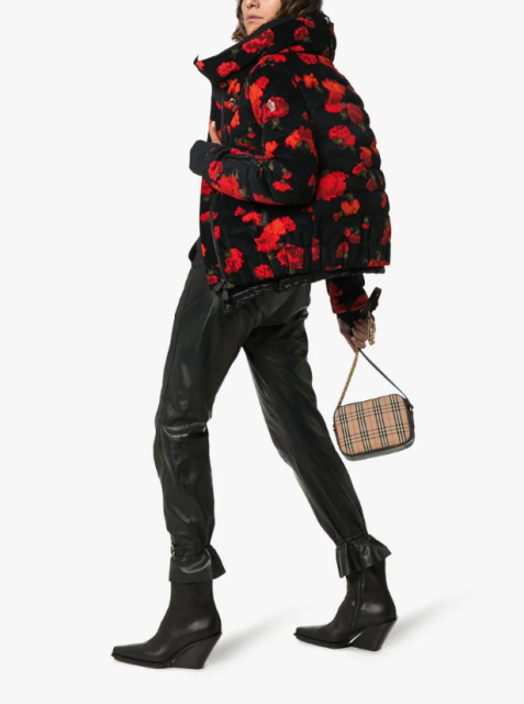 With black leather pants, printed small bag and black leather boots