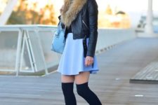 With black shirt, blue skirt, blue bag and heeled boots