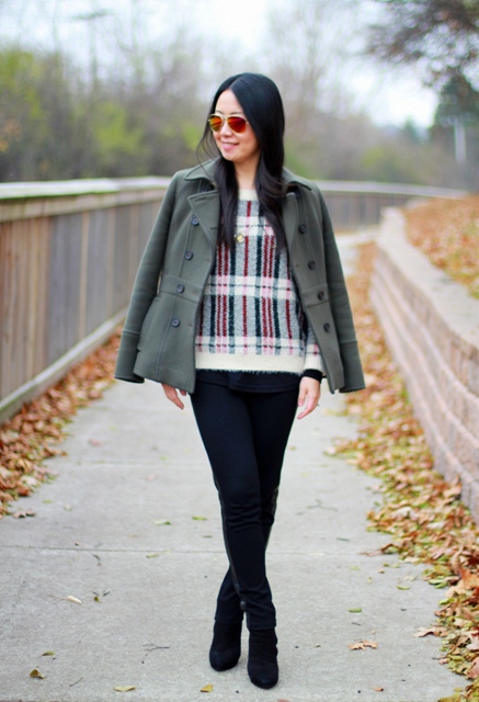 With black skinny pants, black high heeled boots and jacket