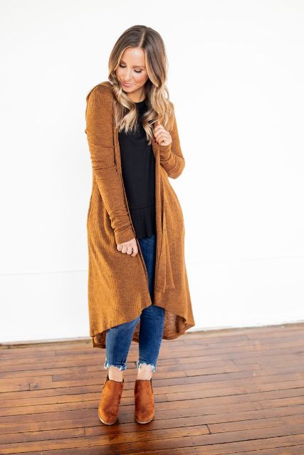 With black t shirt, cropped jeans and brown suede boots