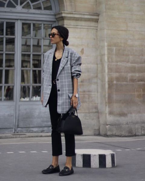 With black top, black cropped pants, bag and flat shoes
