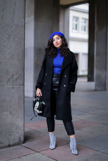 With blue turtleneck, blue beret, black midi coat, gray boots and mini bag