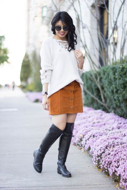 With brown suede mini skirt and black leather high boots