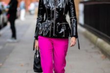 With hot pink pants, black bag and black and brown boots