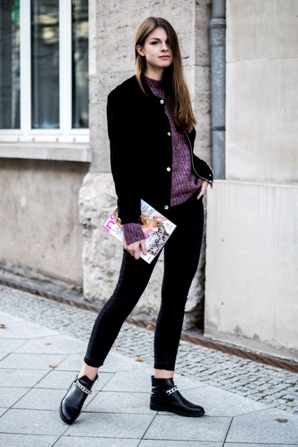 With purple sweater, black cropped pants and flat boots