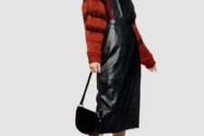 With red and black striped loose sweater, black boots and black half moon bag