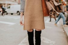 With striped turtleneck, black over the knee boots and brown tote bag