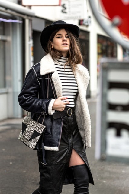 With striped turtleneck, wide brim hat, over the knee boots, printed bag and leather jacket