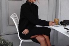 a black knit midi dress with a side slit, blakc trainers will make up a cool casual winter look