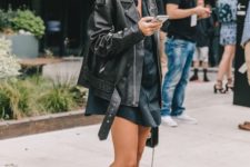 a black mini shirtdress, an oversized black moto jacket and black cowboy boots for the fall