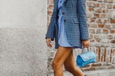a blue shirtdress, a printed vintage-inspired blazer, black and white cowboy boots and a small blue bag