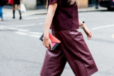 a bright and trendy fall look with burgundy leather culottes, a velvet top with short sleeves and black shoes