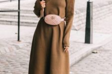 a camel A-line midi knit dress with a turtleneck, long sleeves, a blush waist bag and purple sock boots