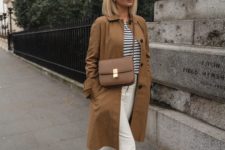 a casual outfit with white jeans, sneakers, a striped tee and a camel trench is finished with a camel Classic Box