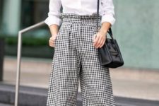 a classic monochromatic work outfit with a white shirt, plaid cropped pants, black heels and a black bag