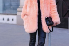 a comfy everyday look with a black top, leather leggings, platform shoes and a peach-colored faux fur short coat