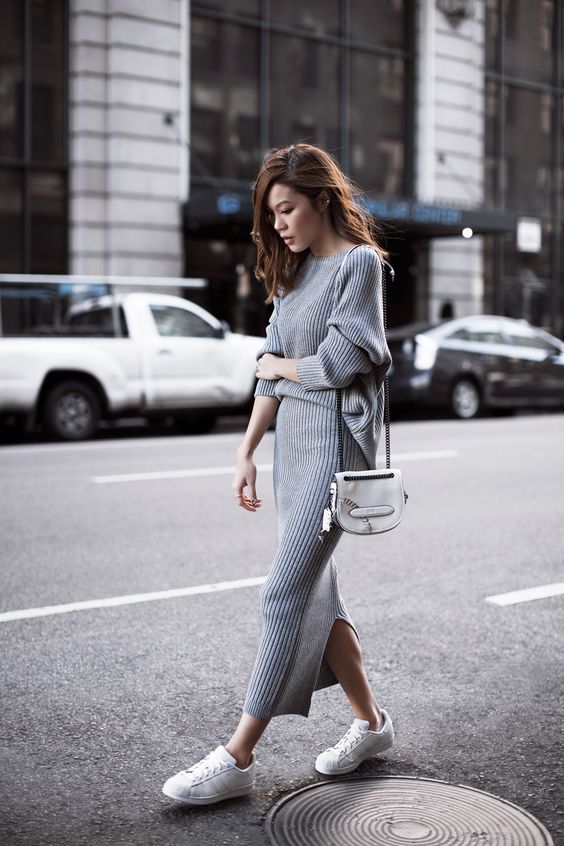a comfy grey knit dress with long sleeves and a high neckline, white sneakers and a white bag