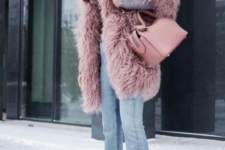 a dusty pink faux fur knee coat, matching crushed velvet booties and a matching bag for a chic look